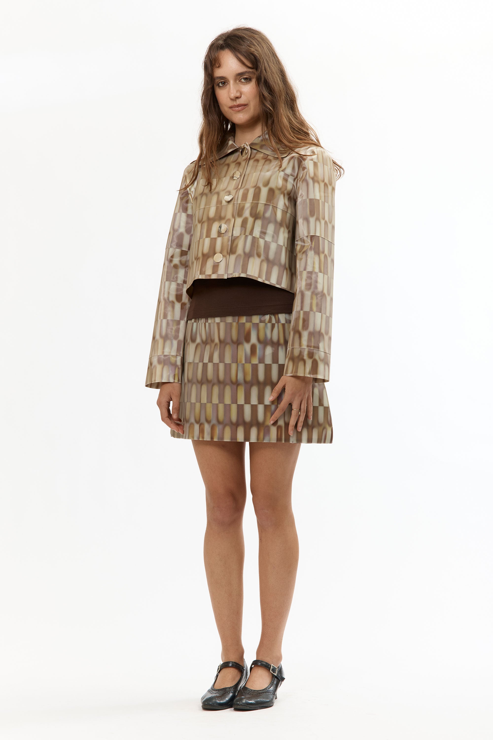 The LENTICULAR CROP BUTTON-UP JACKET TILE BROWN available online with global shipping, and in PAM Stores Melbourne and Sydney.