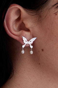 The PEARL DROP ALIEN KISS EARRING available online with global shipping, and in PAM Stores Melbourne and Sydney.