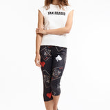 The TAX FRAUD BABY TEE available online with global shipping, and in PAM Stores Melbourne and Sydney.