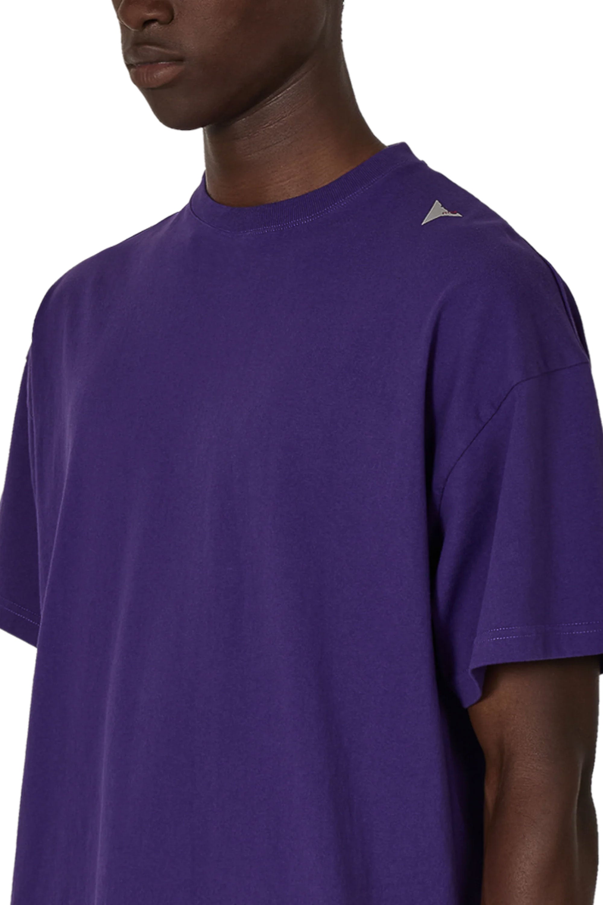 The SS26 Logo T-Shirt Washed Purple available online with global shipping, and in PAM Stores Melbourne and Sydney.