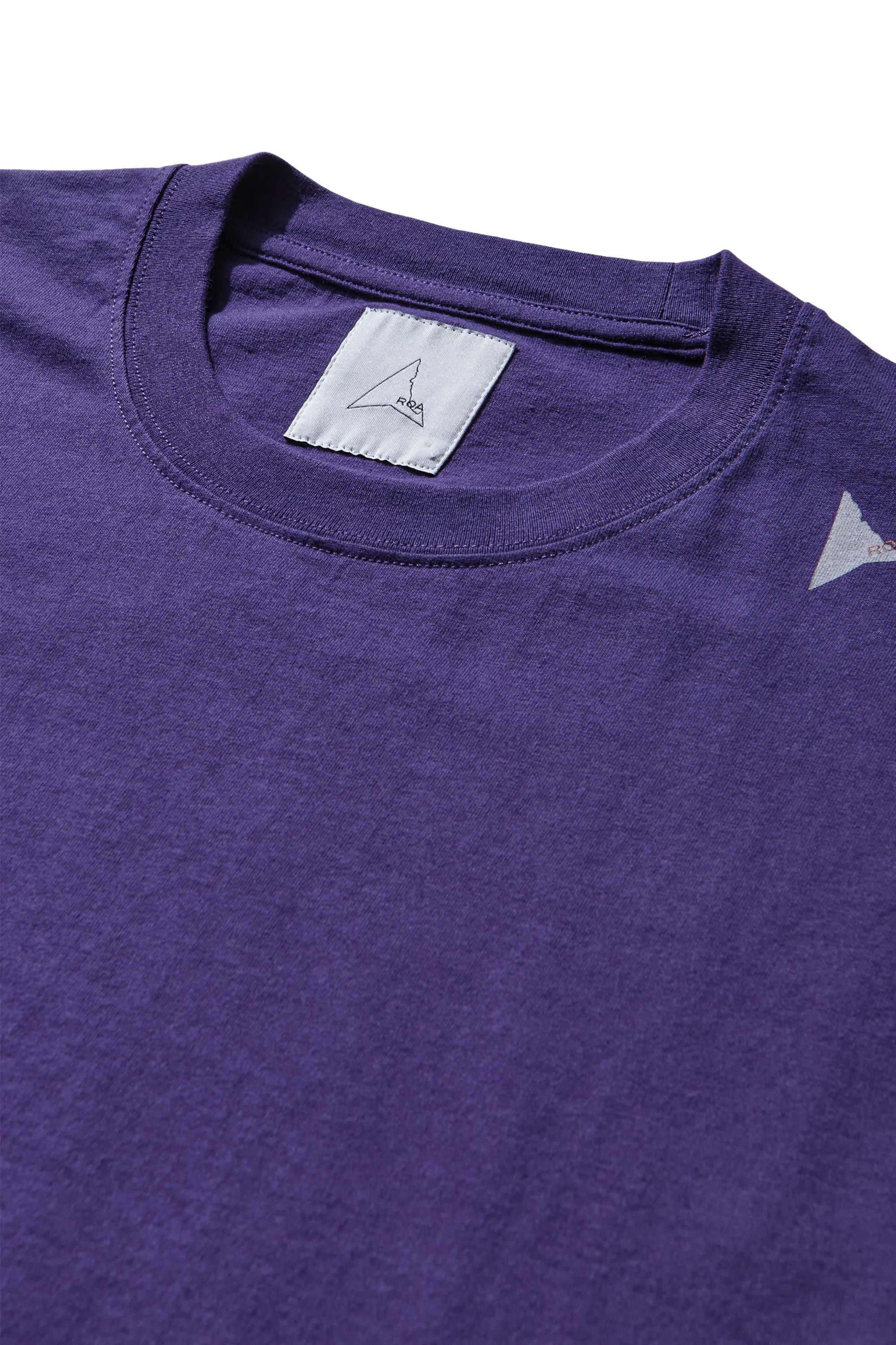 The SS26 Logo T-Shirt Washed Purple available online with global shipping, and in PAM Stores Melbourne and Sydney.