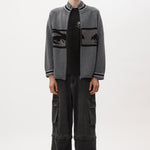 The EYES ZIP THRU KNIT CARDIGAN available online with global shipping, and in PAM Stores Melbourne and Sydney.