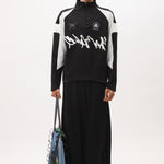 The ANGEL PULLOVER - BLACK WHITE available online with global shipping, and in PAM Stores Melbourne and Sydney.