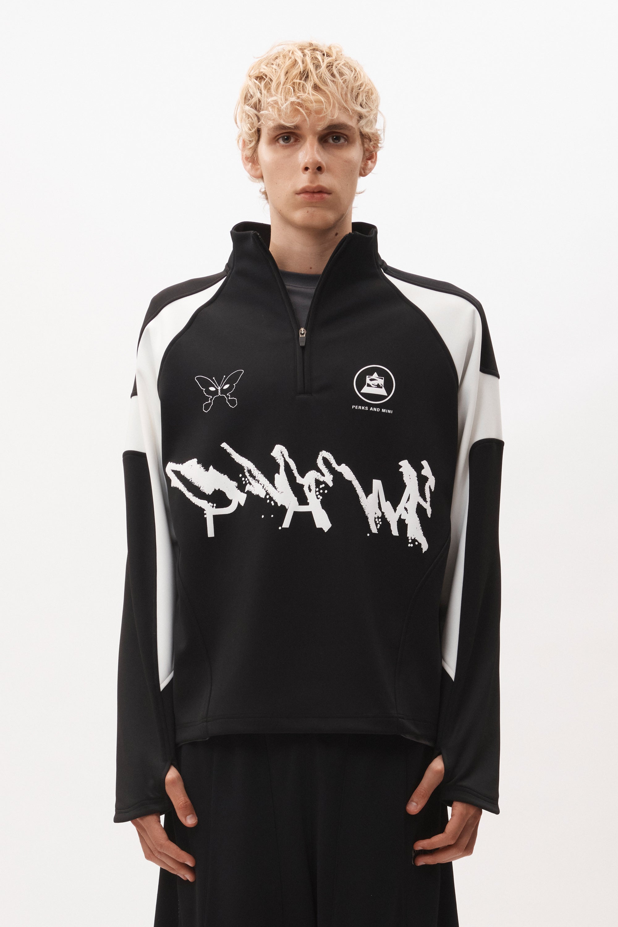 The ANGEL PULLOVER - BLACK WHITE available online with global shipping, and in PAM Stores Melbourne and Sydney.