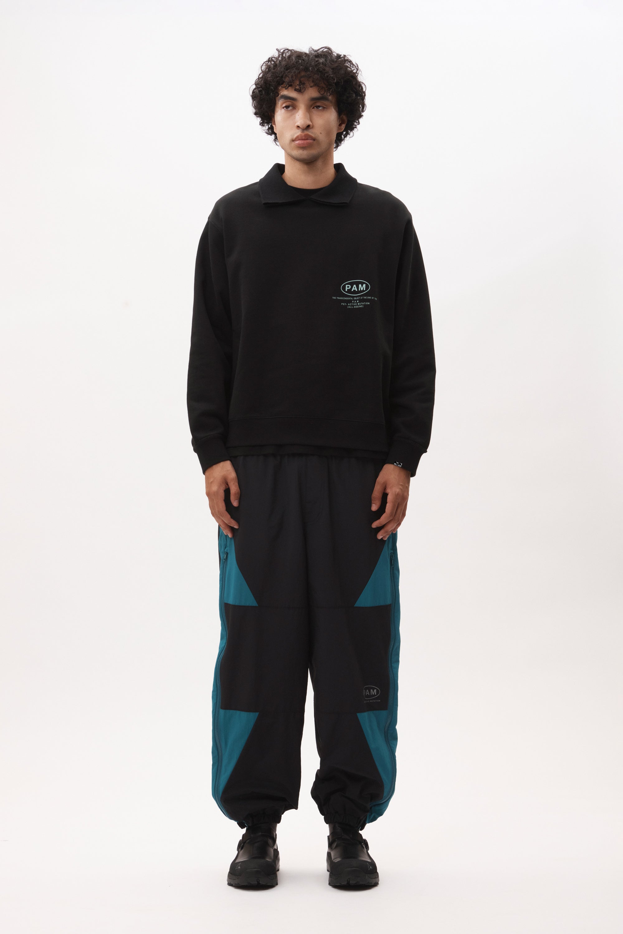 The AKTIV-8 TRACKPANT - BLACK TEAL available online with global shipping, and in PAM Stores Melbourne and Sydney.