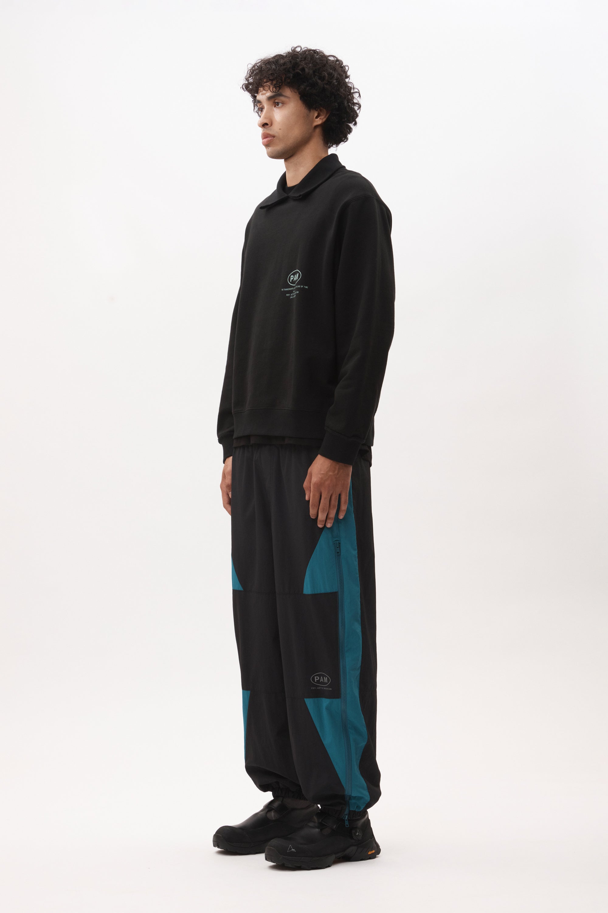 The AKTIV-8 TRACKPANT - BLACK TEAL available online with global shipping, and in PAM Stores Melbourne and Sydney.