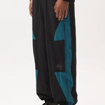 The AKTIV-8 TRACKPANT - BLACK TEAL available online with global shipping, and in PAM Stores Melbourne and Sydney.