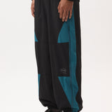 The AKTIV-8 TRACKPANT - BLACK TEAL available online with global shipping, and in PAM Stores Melbourne and Sydney.