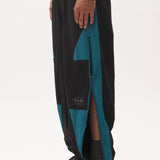 The AKTIV-8 TRACKPANT - BLACK TEAL available online with global shipping, and in PAM Stores Melbourne and Sydney.