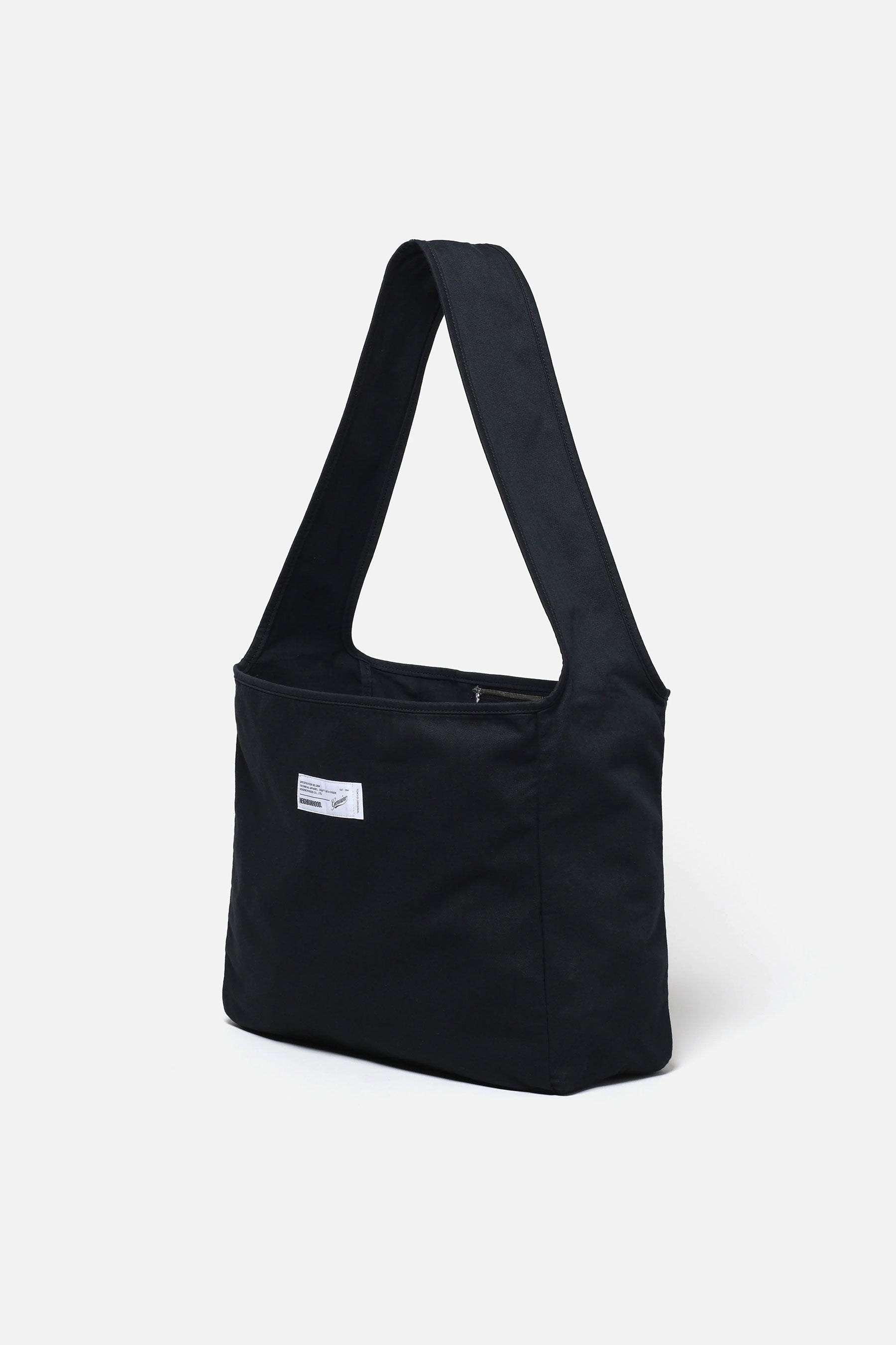 The HBT NEWSPAPER BAG BLACK available online with global shipping, and in PAM Stores Melbourne and Sydney.
