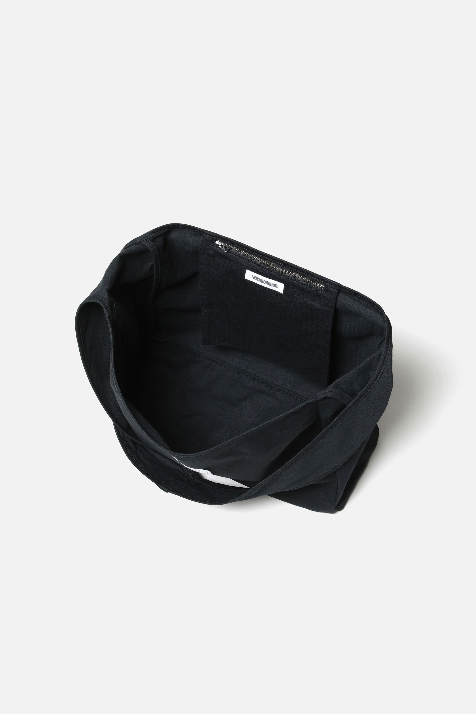 The HBT NEWSPAPER BAG BLACK available online with global shipping, and in PAM Stores Melbourne and Sydney.