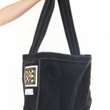 The NEWSPAPER SHOULDER BAG MOD BLACK available online with global shipping, and in PAM Stores Melbourne and Sydney.