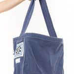 The NEWSPAPER SHOULDER BAG MOD BLUE available online with global shipping, and in PAM Stores Melbourne and Sydney.