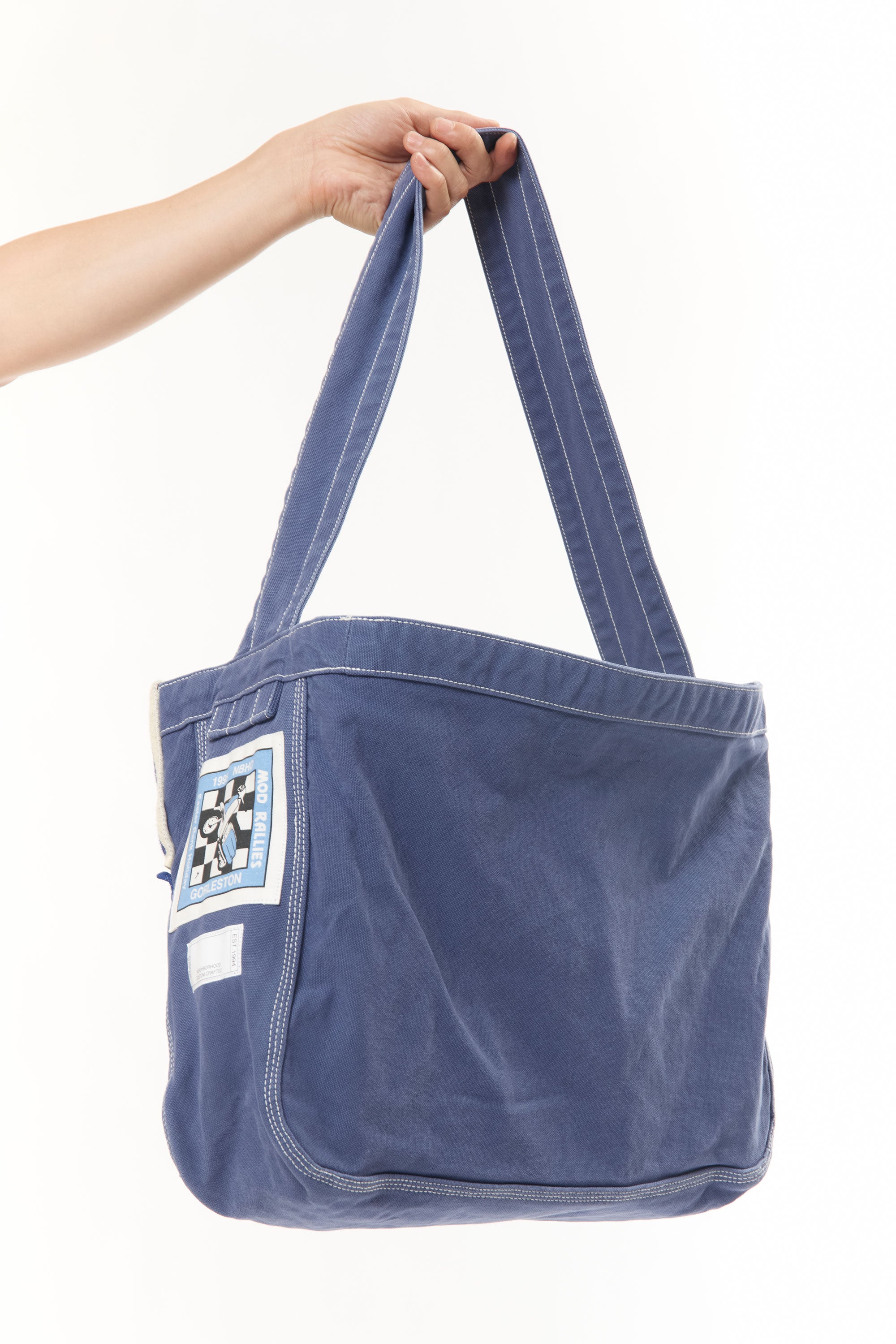 The NEWSPAPER SHOULDER BAG MOD BLUE available online with global shipping, and in PAM Stores Melbourne and Sydney.
