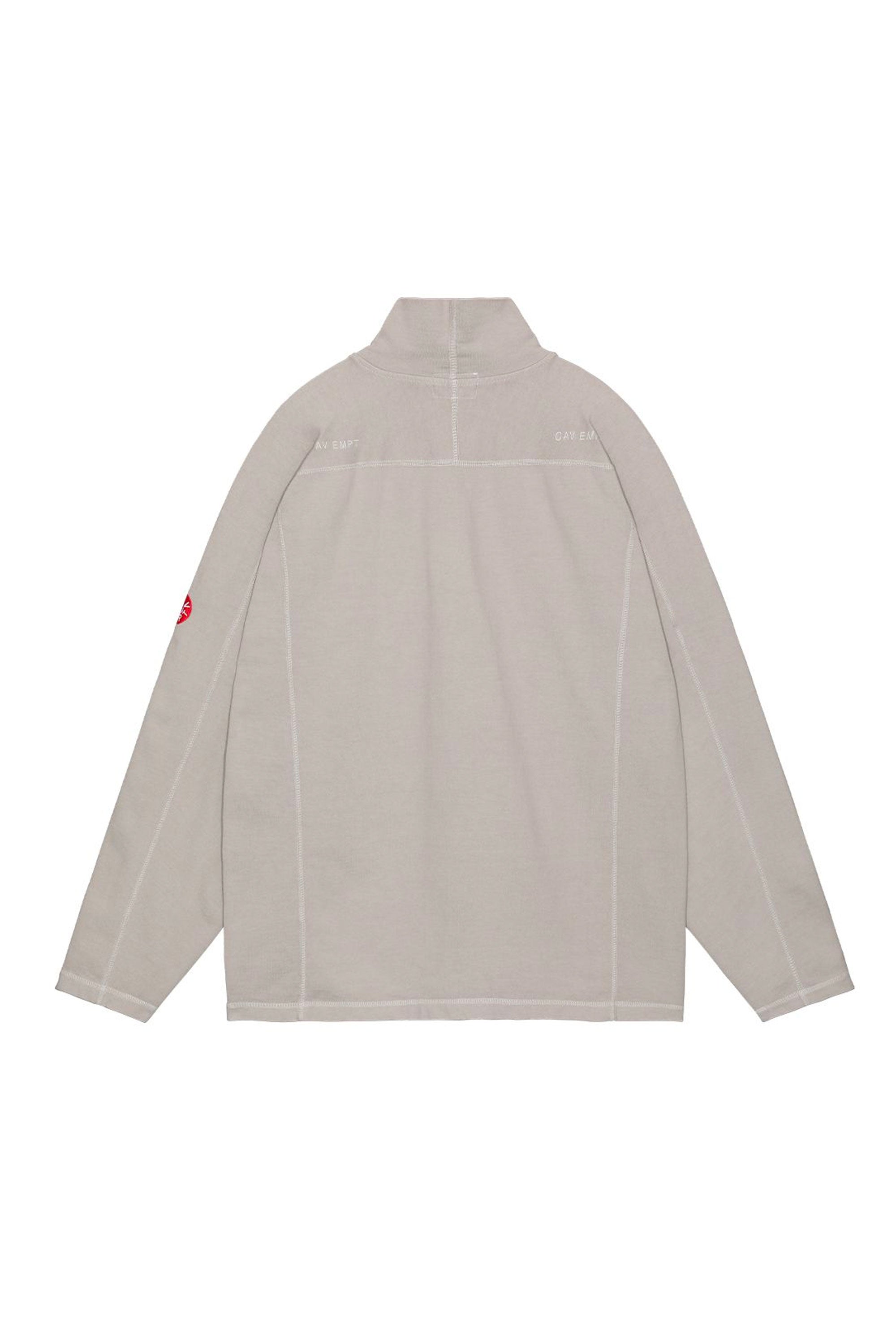 The CAV EMPT - OVERDYE HALF ZIP TURTLE LONG SLEEVE T  available online with global shipping, and in PAM Stores Melbourne and Sydney.