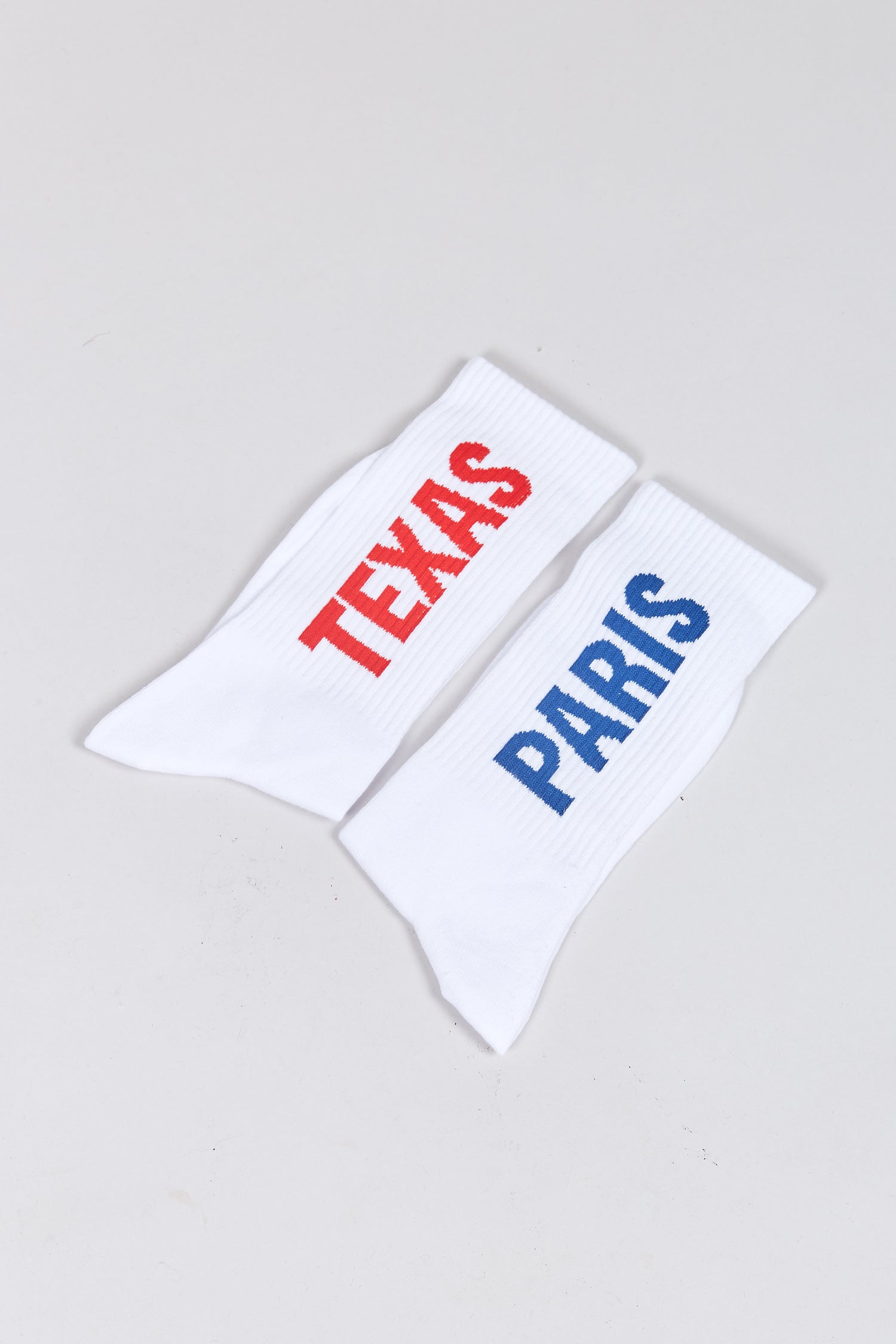 The PARIS, TEXAS SOCKS WHITE  available online with global shipping, and in PAM Stores Melbourne and Sydney.