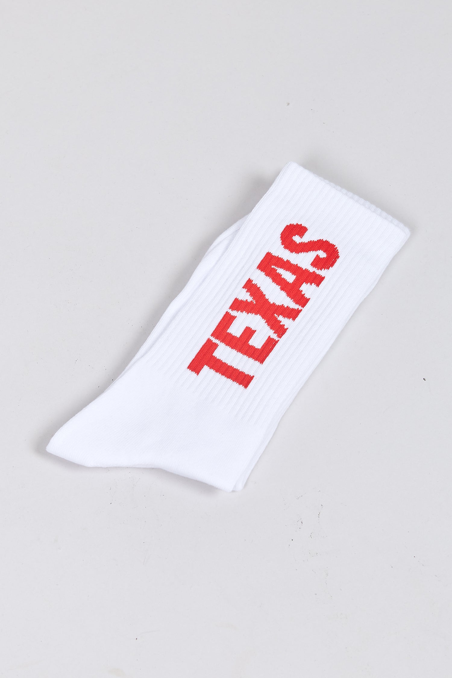 The PARIS, TEXAS SOCKS WHITE  available online with global shipping, and in PAM Stores Melbourne and Sydney.