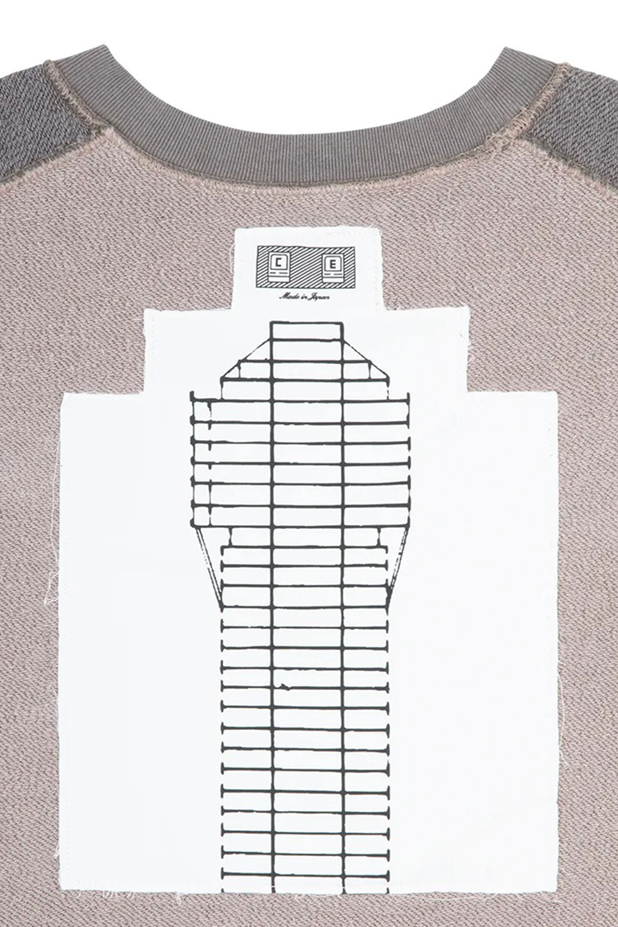 The PANEL SHOULDER CREW NECK BEIGE available online with global shipping, and in PAM Stores Melbourne and Sydney.