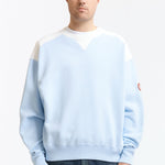 The PANEL SHOULDER CREW NECK BLUE available online with global shipping, and in PAM Stores Melbourne and Sydney.