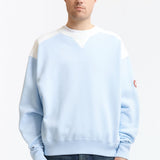 The PANEL SHOULDER CREW NECK BLUE available online with global shipping, and in PAM Stores Melbourne and Sydney.
