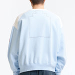 The PANEL SHOULDER CREW NECK BLUE available online with global shipping, and in PAM Stores Melbourne and Sydney.