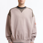 The PANEL SHOULDER CREW NECK BEIGE available online with global shipping, and in PAM Stores Melbourne and Sydney.