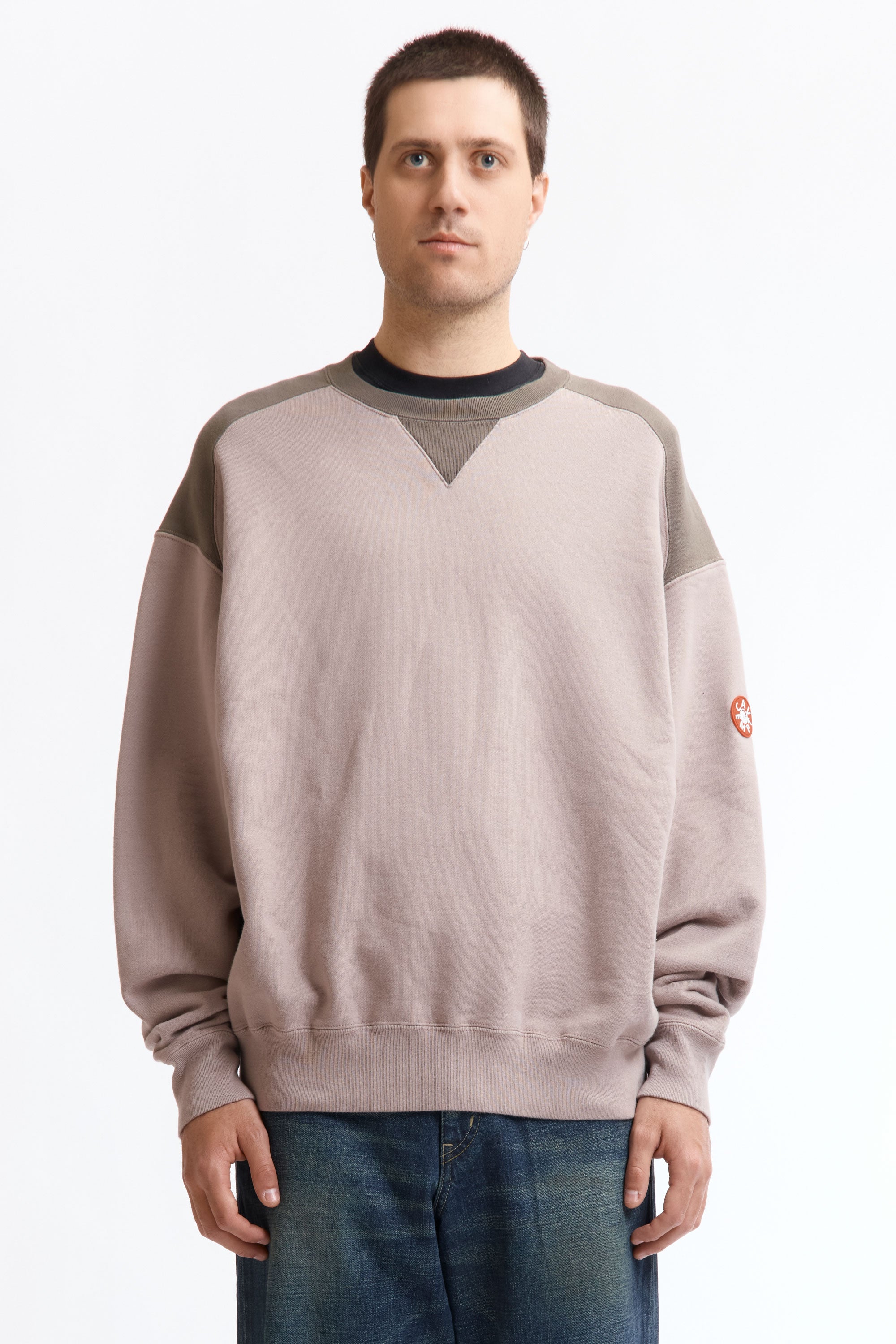 The PANEL SHOULDER CREW NECK BEIGE available online with global shipping, and in PAM Stores Melbourne and Sydney.