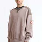 The PANEL SHOULDER CREW NECK BEIGE available online with global shipping, and in PAM Stores Melbourne and Sydney.