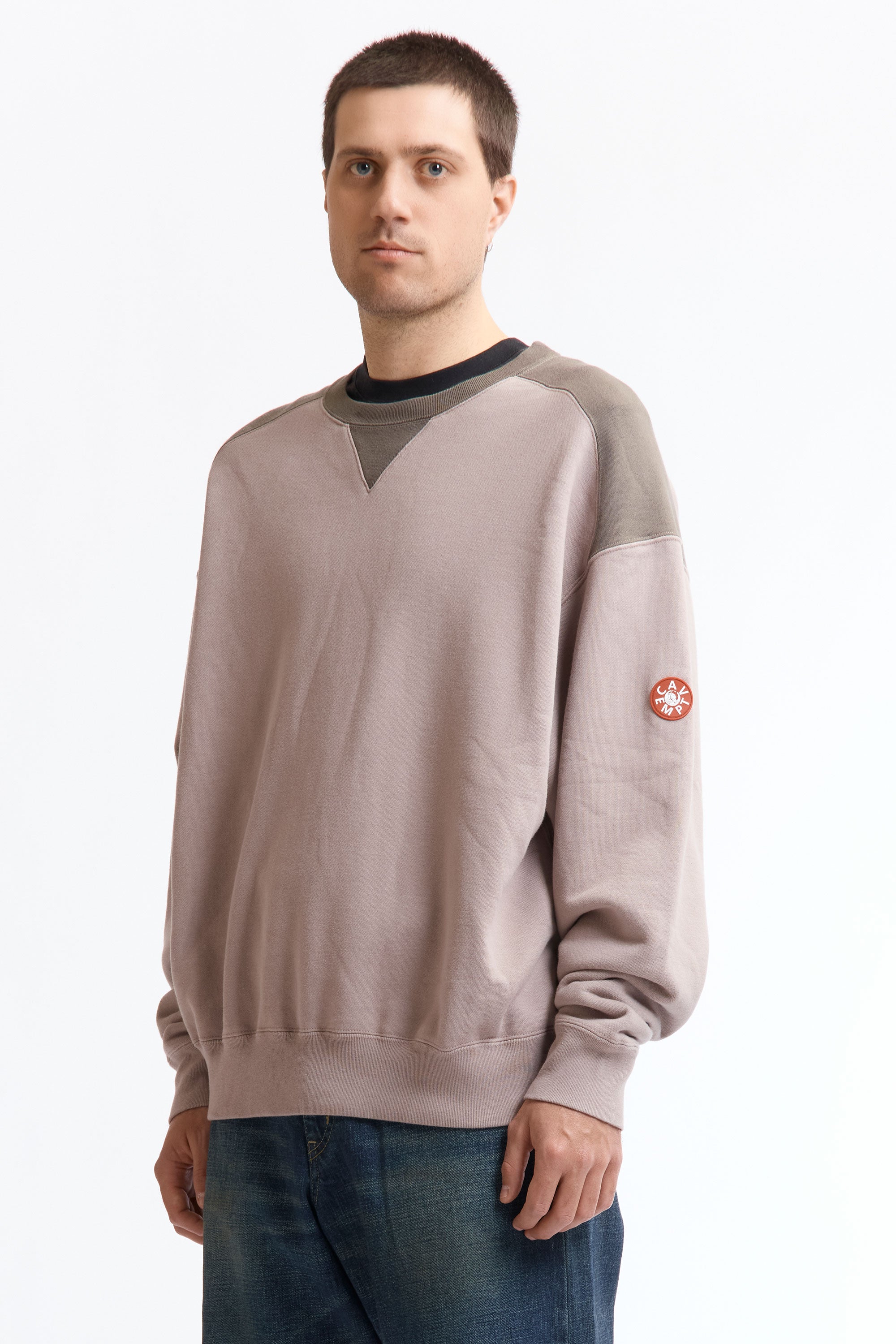 The PANEL SHOULDER CREW NECK BEIGE available online with global shipping, and in PAM Stores Melbourne and Sydney.