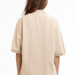 The MANGA POLO SHIRT BEIGE available online with global shipping, and in PAM Stores Melbourne and Sydney.