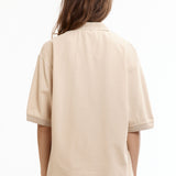 The MANGA POLO SHIRT BEIGE available online with global shipping, and in PAM Stores Melbourne and Sydney.