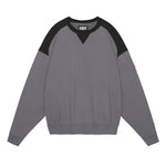 The PANEL SHOULDER CREW NECK CHARCOAL  available online with global shipping, and in PAM Stores Melbourne and Sydney.