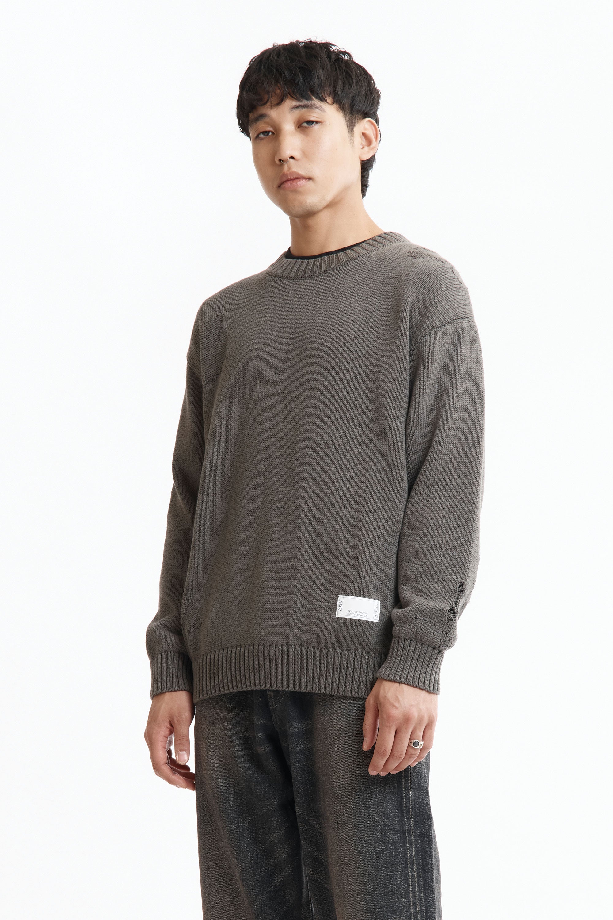 The SS26 NH SAVAGE CREWNECK SWEATER CHARCOAL available online with global shipping, and in PAM Stores Melbourne and Sydney.