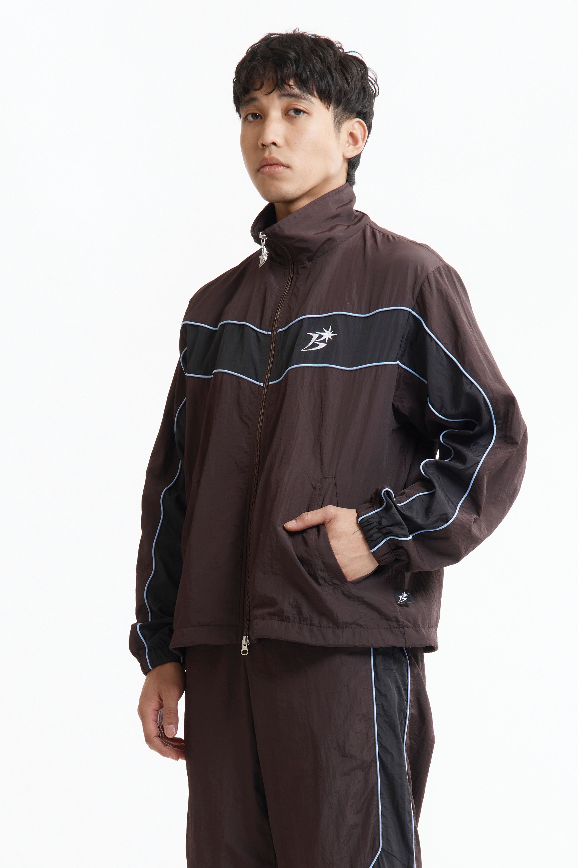 The Panelled Track Jacket Brown available online with global shipping, and in PAM Stores Melbourne and Sydney.