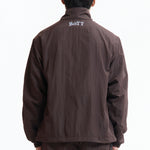The Panelled Track Jacket Brown available online with global shipping, and in PAM Stores Melbourne and Sydney.