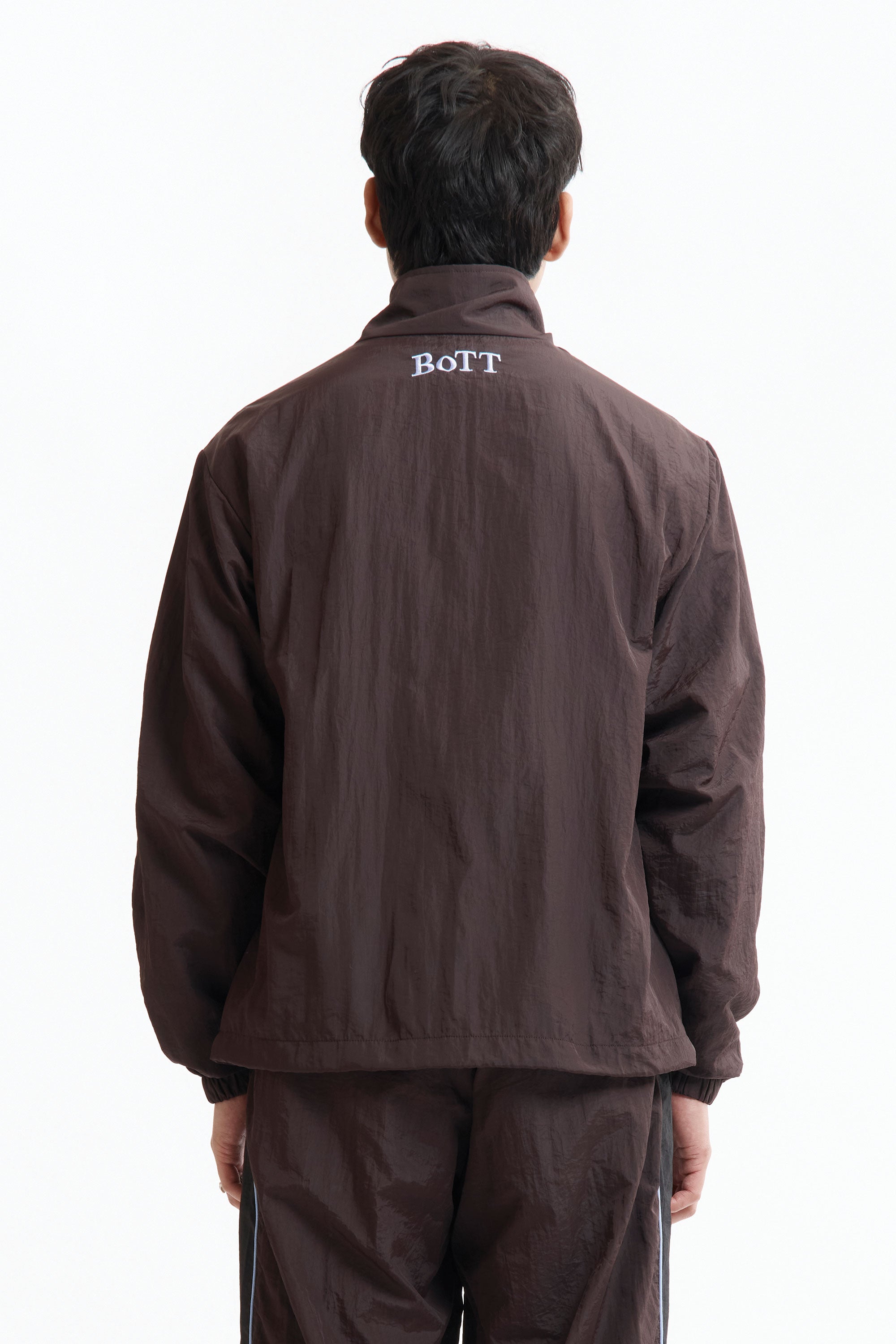 The Panelled Track Jacket Brown available online with global shipping, and in PAM Stores Melbourne and Sydney.