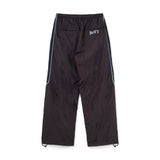 The Panelled Track Pant Brown available online with global shipping, and in PAM Stores Melbourne and Sydney.