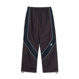 The Panelled Track Pant Brown available online with global shipping, and in PAM Stores Melbourne and Sydney.
