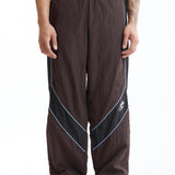 The Panelled Track Pant Brown available online with global shipping, and in PAM Stores Melbourne and Sydney.