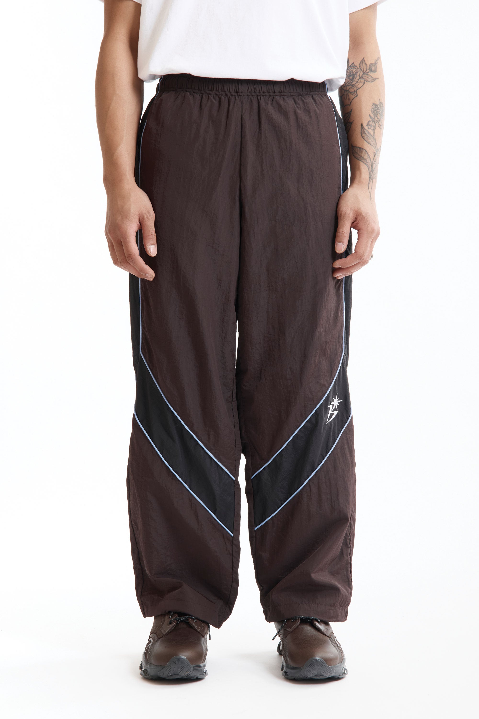 The Panelled Track Pant Brown available online with global shipping, and in PAM Stores Melbourne and Sydney.