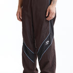 The Panelled Track Pant Brown available online with global shipping, and in PAM Stores Melbourne and Sydney.