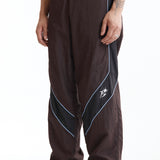 The Panelled Track Pant Brown available online with global shipping, and in PAM Stores Melbourne and Sydney.