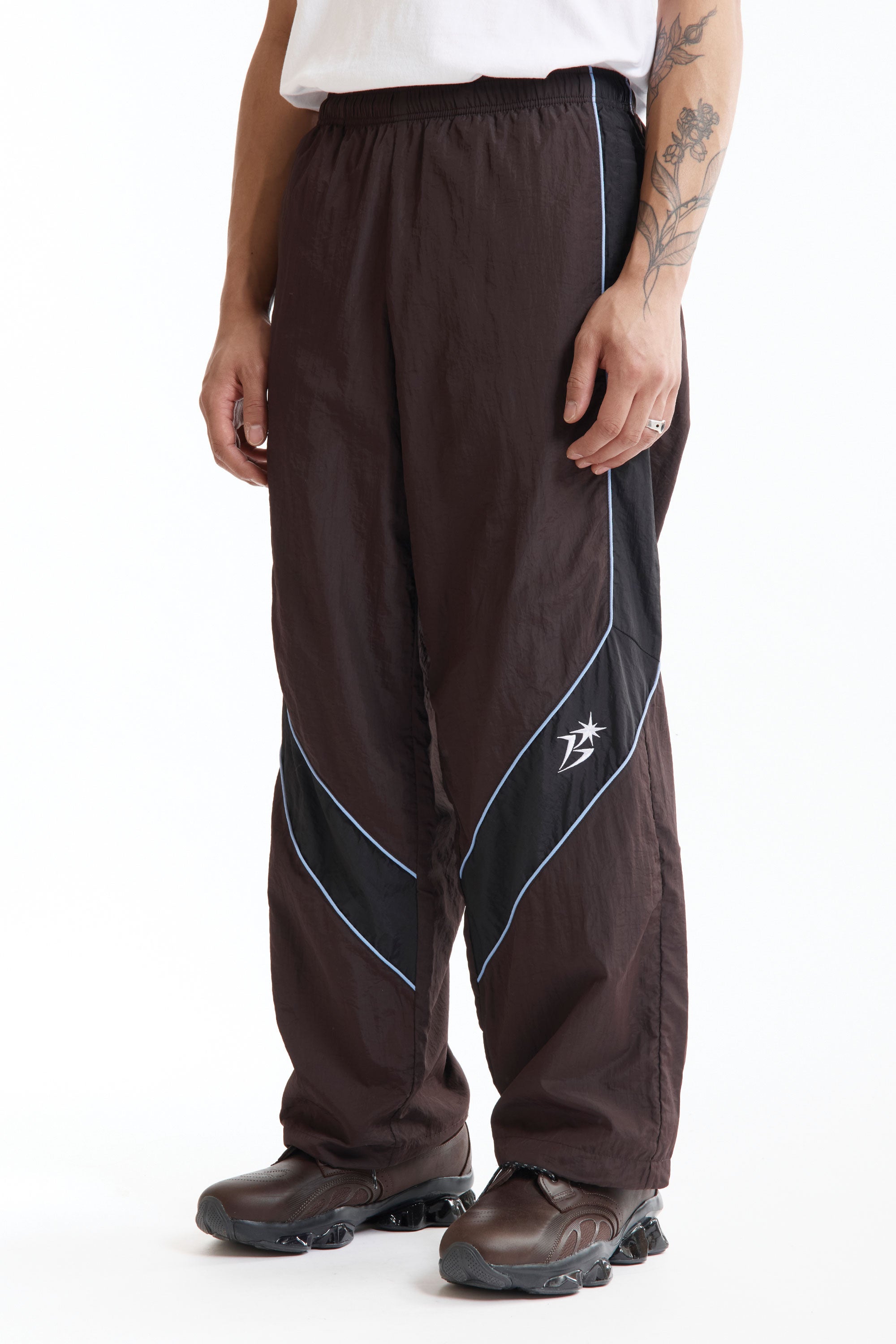 The Panelled Track Pant Brown available online with global shipping, and in PAM Stores Melbourne and Sydney.