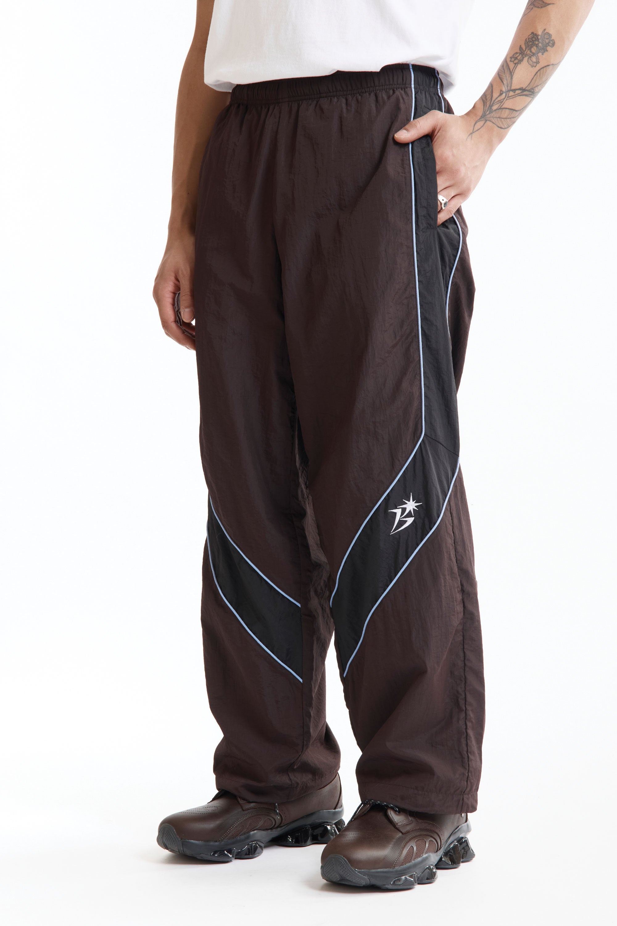 The Panelled Track Pant Brown available online with global shipping, and in PAM Stores Melbourne and Sydney.