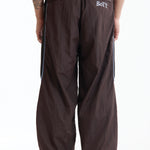 The Panelled Track Pant Brown available online with global shipping, and in PAM Stores Melbourne and Sydney.