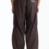 The Panelled Track Pant Brown available online with global shipping, and in PAM Stores Melbourne and Sydney.