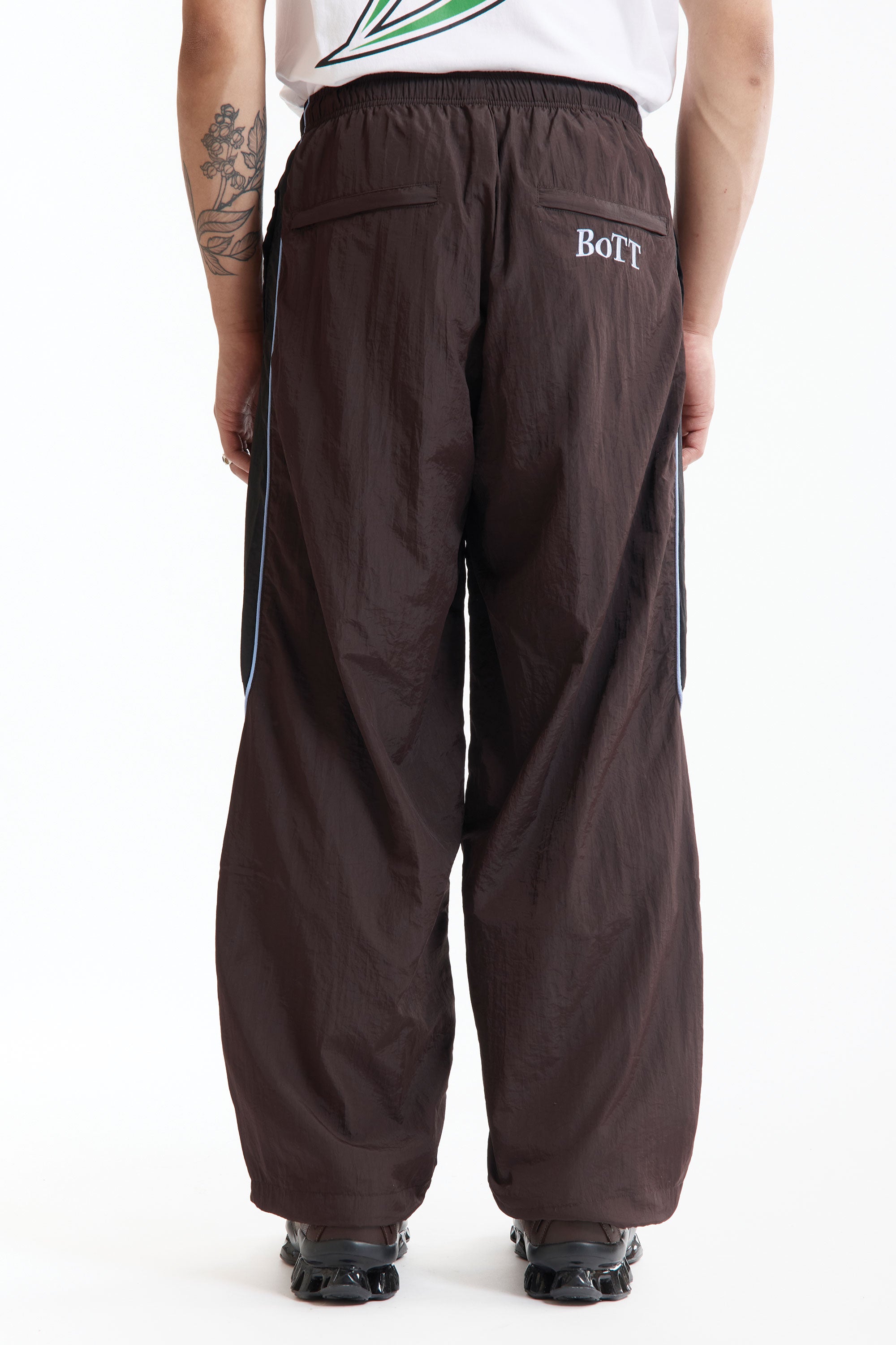 The Panelled Track Pant Brown available online with global shipping, and in PAM Stores Melbourne and Sydney.