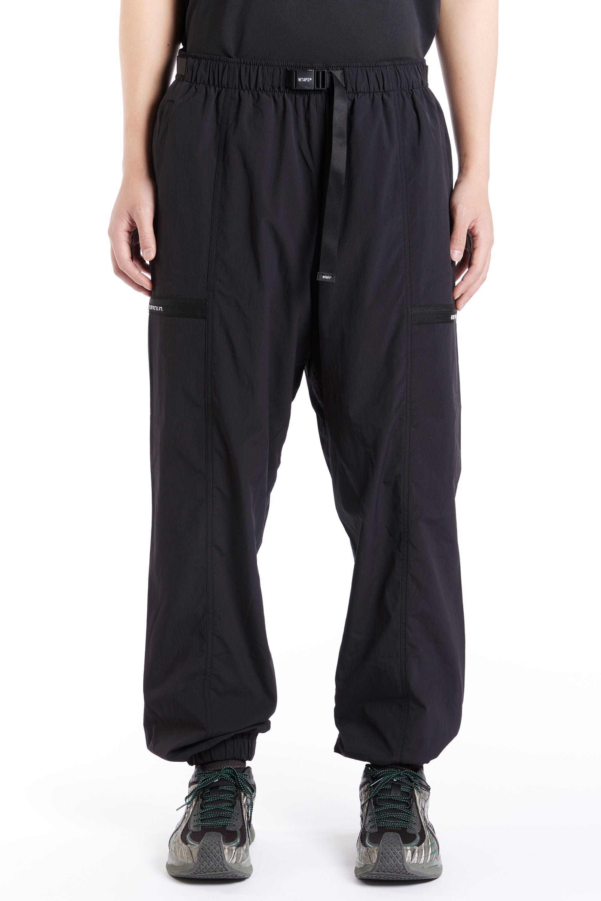 The WTAPS - TRACKS PANTS 03 SS24 BLACK available online with global shipping, and in PAM Stores Melbourne and Sydney.