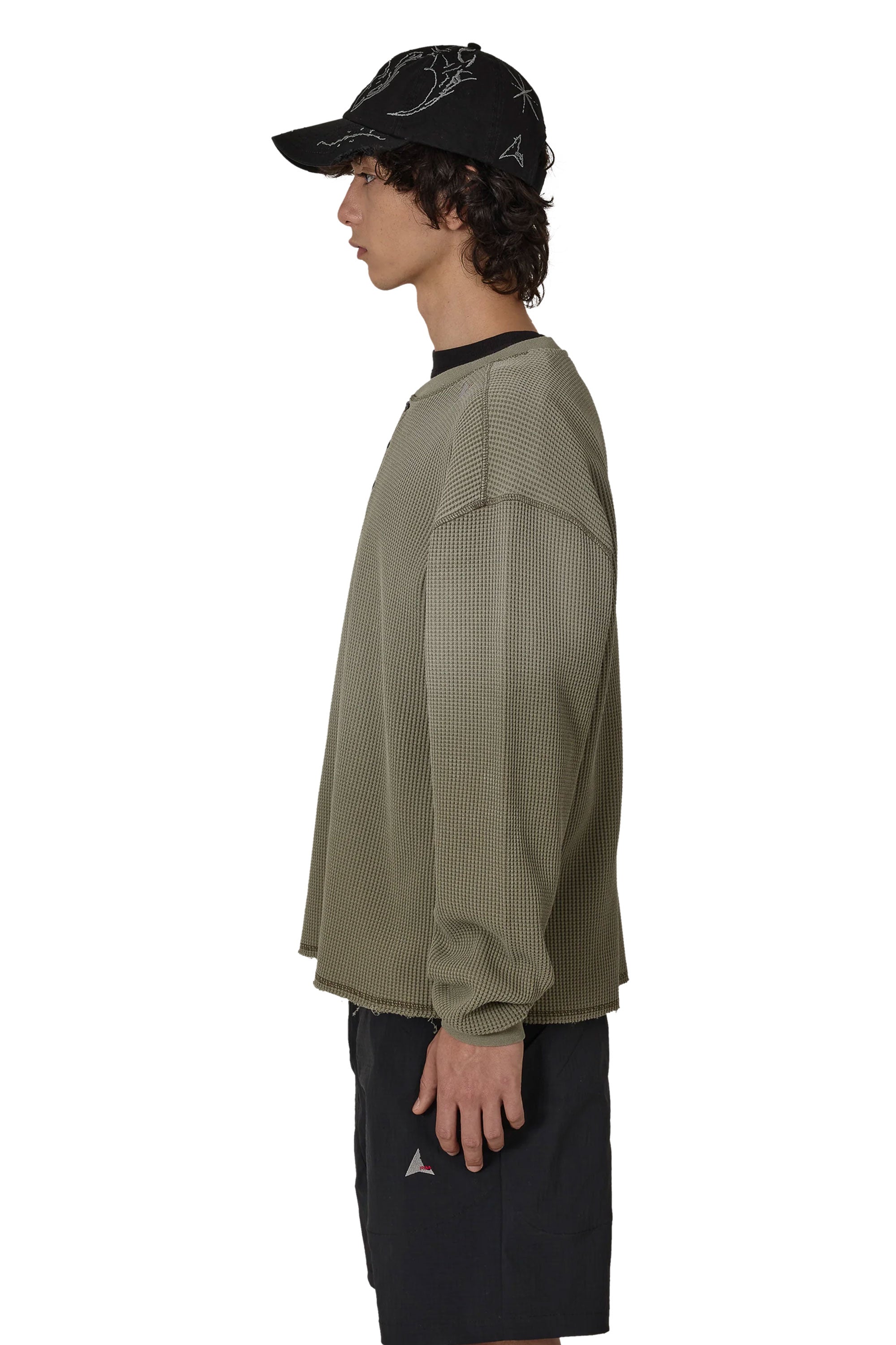The ROA Bee Sun Faded Organic Waffle Serafino Long Sleeve Grey Green available online with global shipping, and in PAM Stores Melbourne and Sydney.