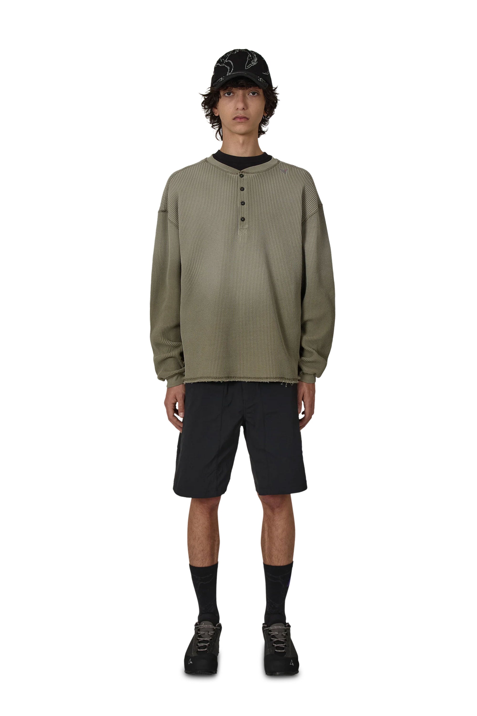 The ROA Bee Sun Faded Organic Waffle Serafino Long Sleeve Grey Green available online with global shipping, and in PAM Stores Melbourne and Sydney.